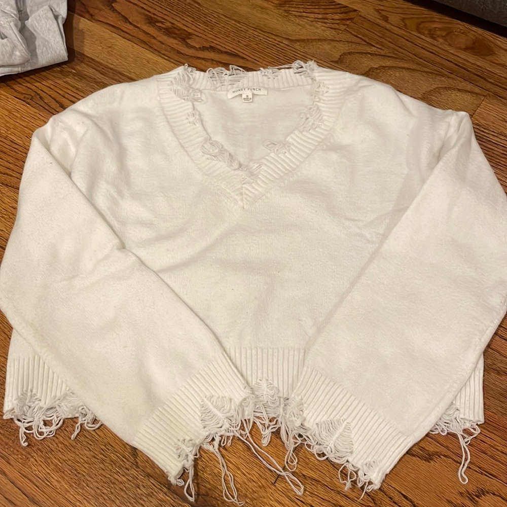 White sweater. distressed V neck